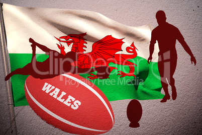 Composite image of silhouette of rugby player