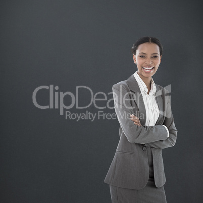 Composite image of portrait of smiling businesswoman standing ar