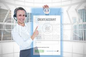Composite image of smiling businesswoman with headset pointing
