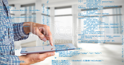 Composite image of geeky businessman using his tablet pc