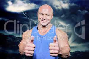 Composite image of smiling healthy man showing thumbs up