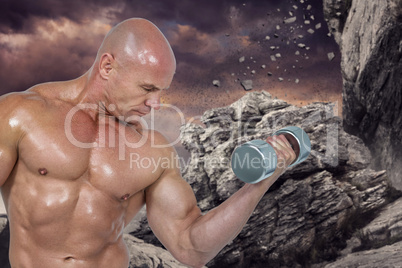 Composite image of bodybuilder concentrating while lifting dumbb