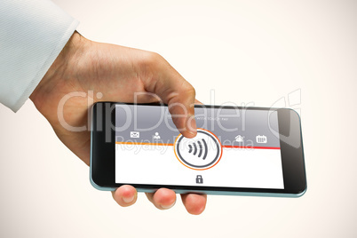 Composite image of hand holding smartphone Composite image of hand holding smartphone