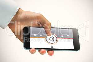 Composite image of hand holding smartphone