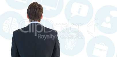 Composite image of rear view of businessman standing
