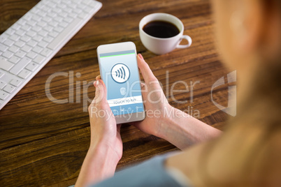 Composite image of woman using smartphone