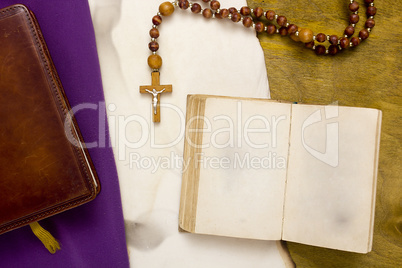 Ancient book with Catholic cross