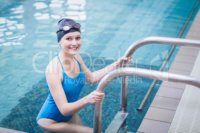 Fit woman getting out of the water