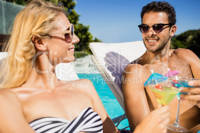 Couple relaxing on deckchairs