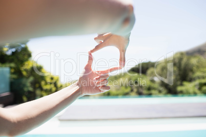 Woman making square with hands