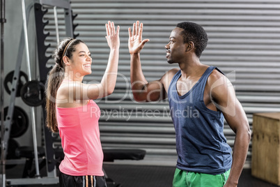 Fit couple doing high five