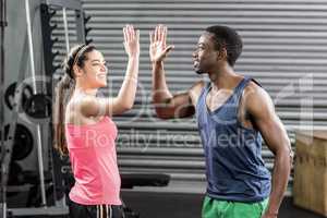 Fit couple doing high five