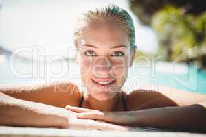 Portrait of beautiful blonde in the pool