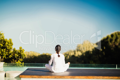 Calm brunette doing yoga