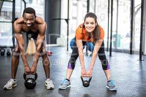 Athletic man and woman working out