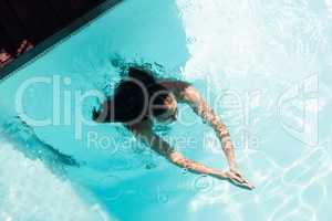 Fit woman swimming in the pool