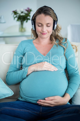 Pregnant woman listening to music