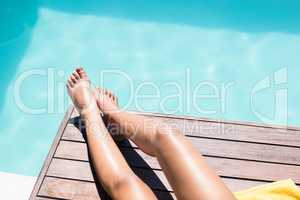 Feet of woman on pool edge