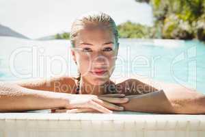 Portrait of beautiful blonde in the pool