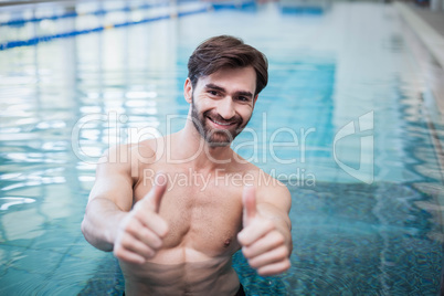 Fit man with thumbs up