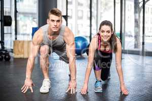 Athletic couple stretching