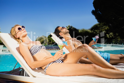 Couple relaxing on deckchairs