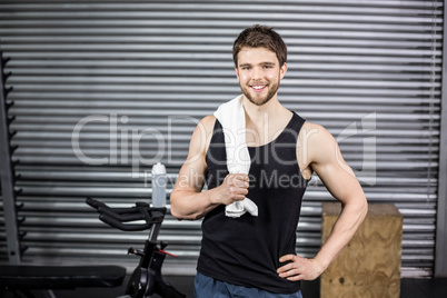 Fit man posing with towel