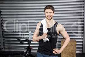 Fit man posing with towel