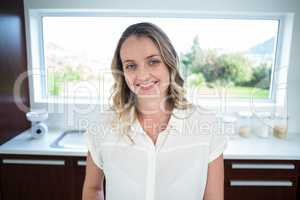 Pregnant woman smiling at camera