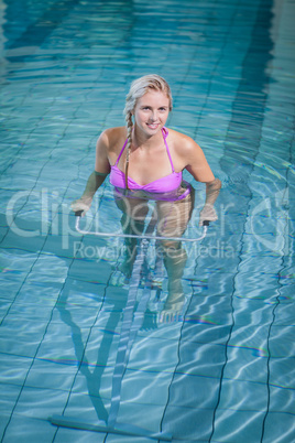 Fit woman doing underwater bike
