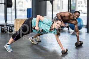 Athletic man and woman working out