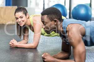 Athletic man and woman working out