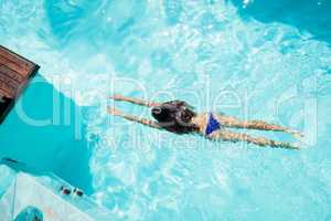 Fit woman swimming in the pool