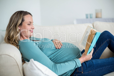 Pregnant woman reading a book