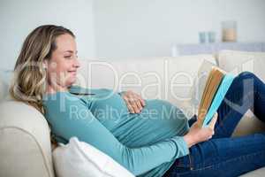 Pregnant woman reading a book