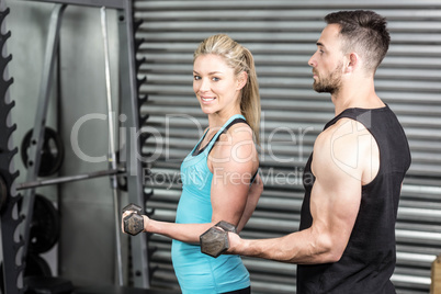 Couple posing with dumbbells