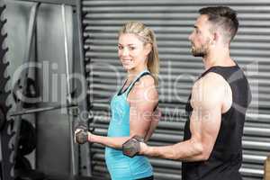 Couple posing with dumbbells