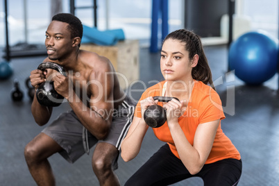 Athletic man and woman working out