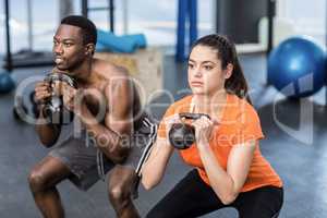 Athletic man and woman working out