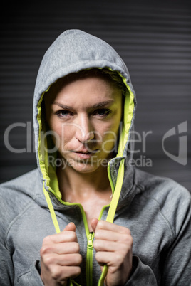 Portrait of woman wearing hood