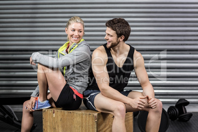 Fit couple smiling at each other