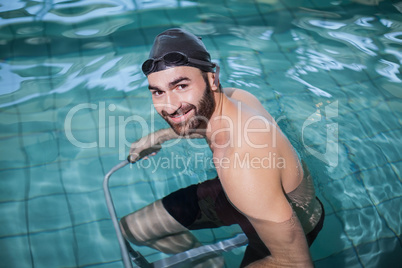 Focused man doing underwater bike