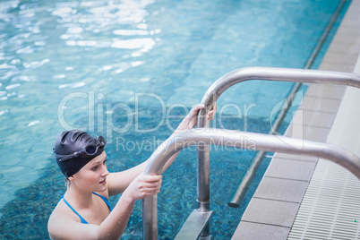 Fit woman getting out of the water