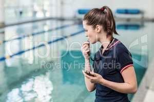 Fit woman blowing whistle
