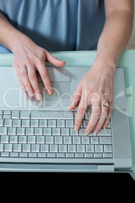 Close up view of businesswoman using laptop