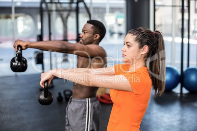 Athletic man and woman working out