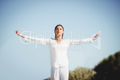 Calm brunette doing yoga