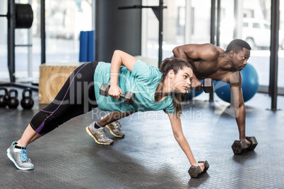 Athletic man and woman working out