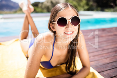 Fit brunette lying on towel