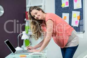 Pregnant woman using laptop